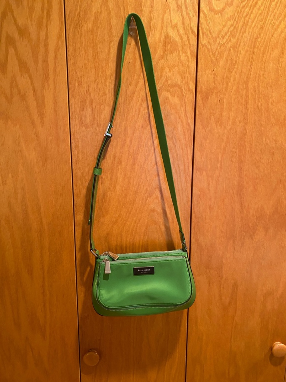 Nylon and stiff leather cross body bag, with adjustable strap.
10” x 6” x 4 1/2”